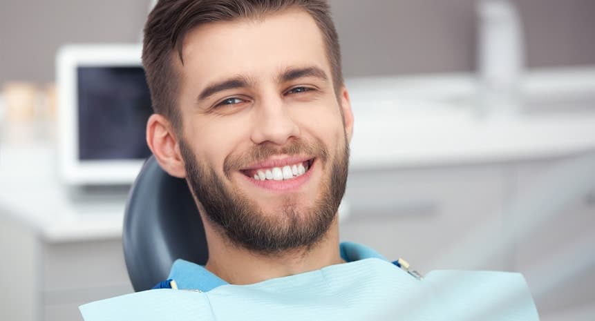 Boy Smiling in Dental Chair