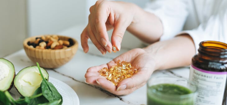 Woman holding hang full of vitamins