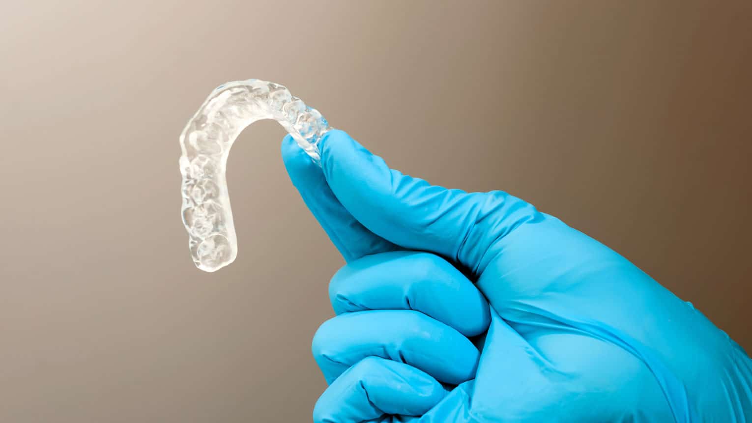 How To Clean Invis Cleaning Invisalign: A How-To Guide - Aurora Dental Group
